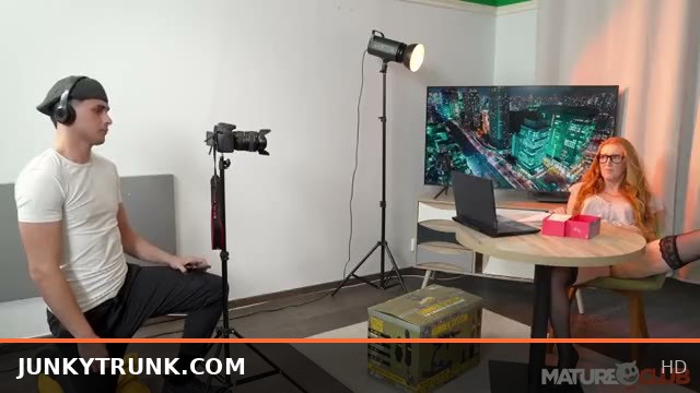 Busty Redhead Showhost Lenka Seduces Her New Cameraman in Steamy Encounter